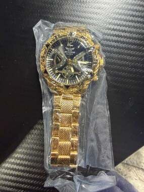 ZHOWE Men's Gold Tone Quartz Watch with Black Dial and Textured Bezel
